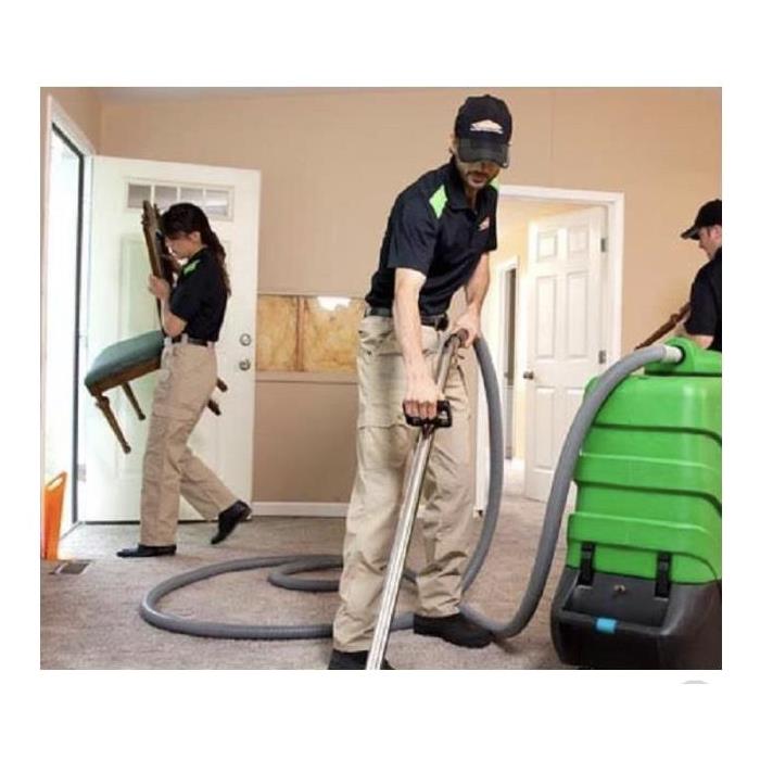 A SERVPRO team performing a carpet cleaning